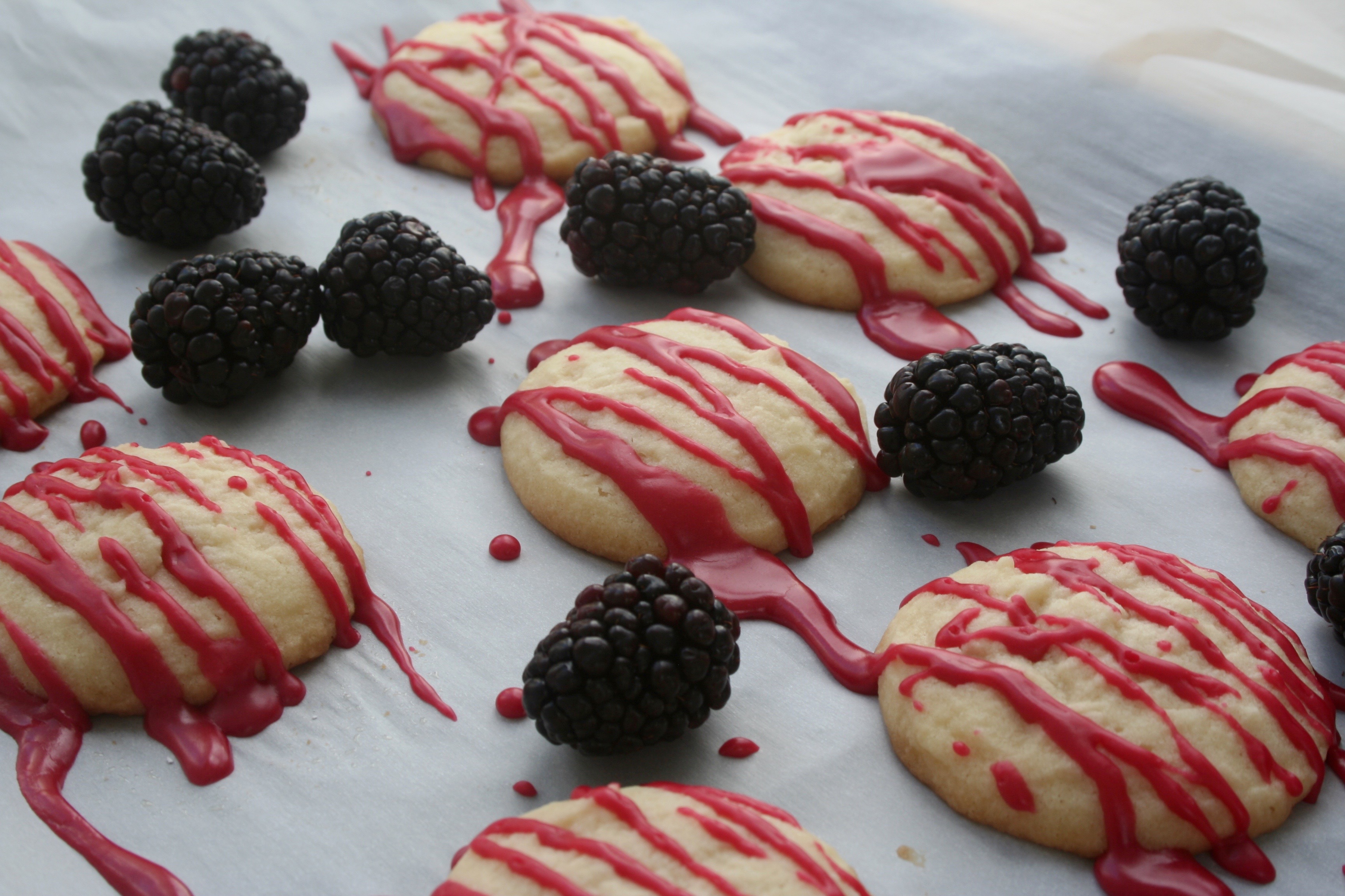 whipped shortbread cookies with blackberry glaze