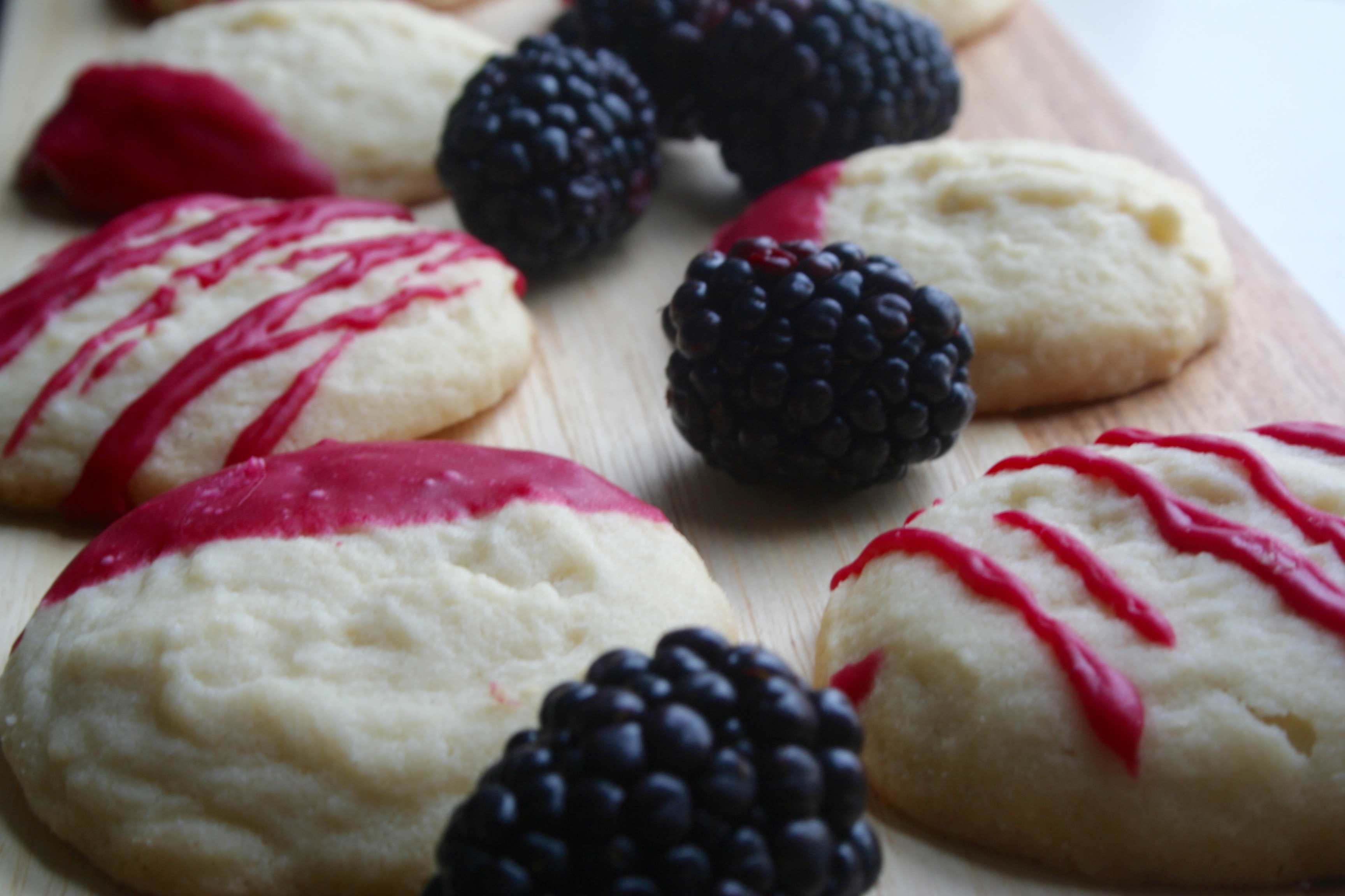 whipped shortbread cookies with blackberry icing