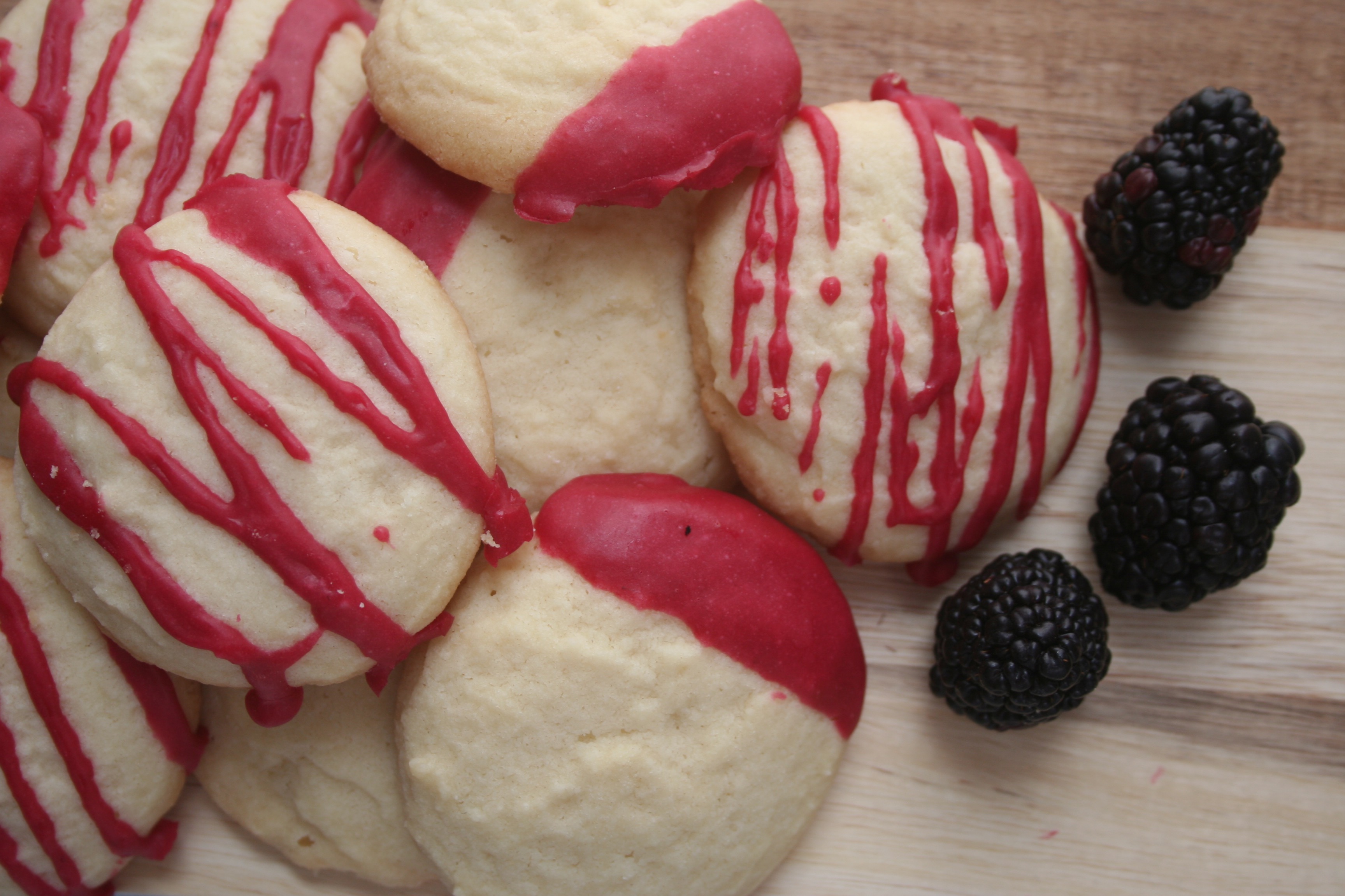 whipped shortbread cookies with blackberry icing