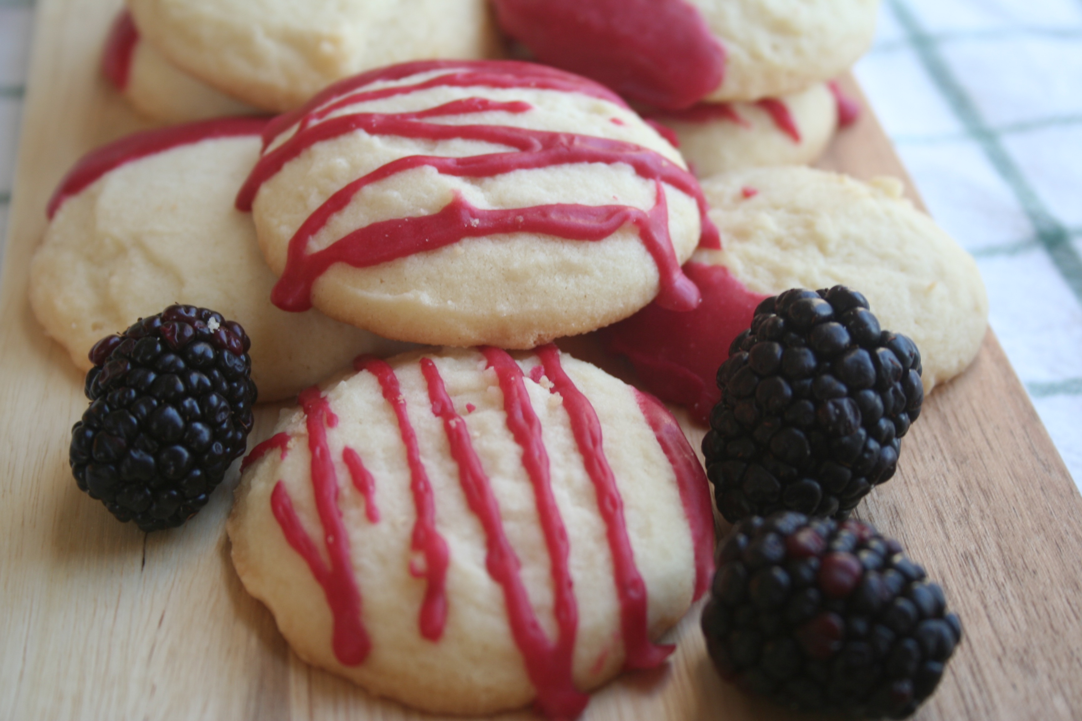 whipped shortbread cookies with blackberry icing